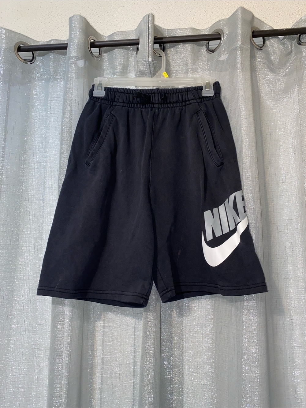 Nike Black Athletic Shorts with White Swoosh Graphic